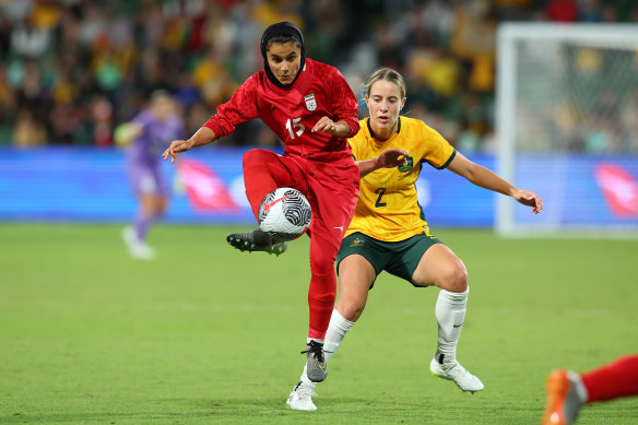 Negin Zandi of Iran volleys the ball.