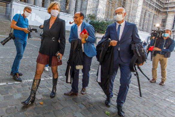 Delphine Boel and her lawyer Marc Uyttendaele, centre, leave the last hearing at the Court of Appeal in Brussels, Belgium, on Thursday.