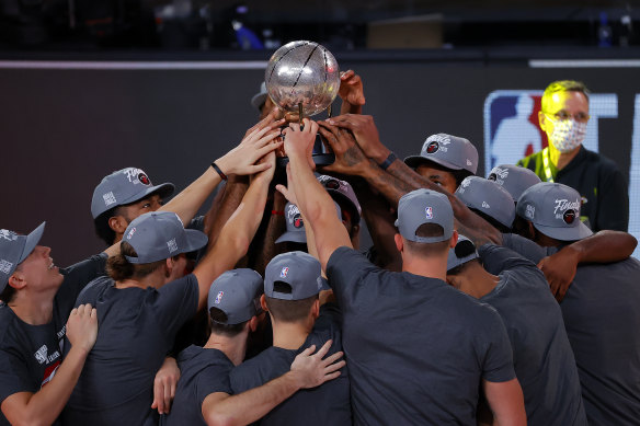 The Heat celebrate with their trophy.