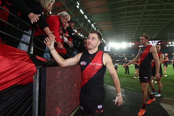 Zach Merrett of the Bombers thanks fans after his club’s win over Sydney.
