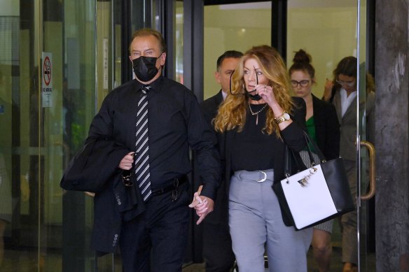 Complainant Brett Sengstock accompanied by his partner leaves the Downing Centre courts on Monday.