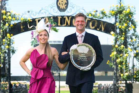 Olympian Sam Williamson and fiancée Linnea Lindberg with the Cox Plate at Flemington.