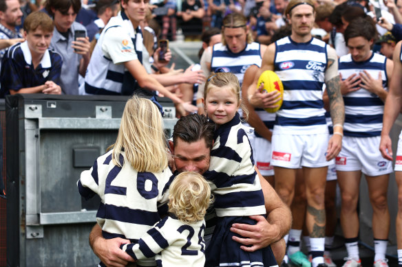 Tom Hawkins shares a moment with his kids before game 350.