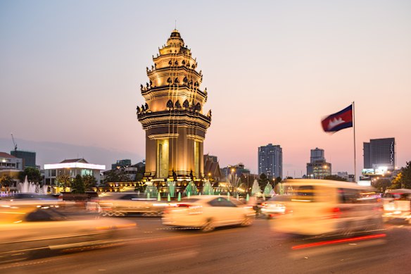 Traffic rushes around the Khmer-influenced Independence Monument, in Phnom Penh, Cambodia’s capital city. 