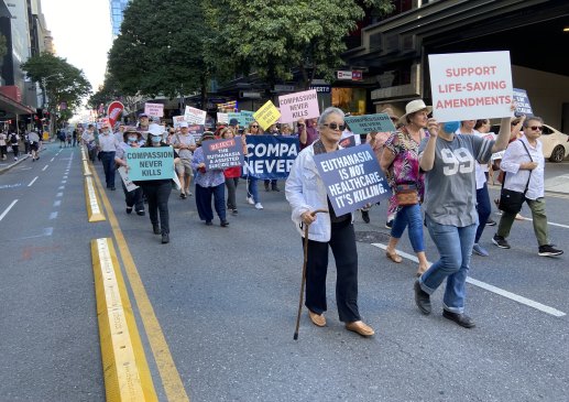 Protesters against the Queensland Government Voluntary Assisted Dying Bill march quietly through the streets calling out “Kill the Bill, not the patient.”