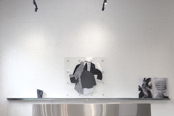 Paper patterns created over the years circle the studio, softening the harder finishes.