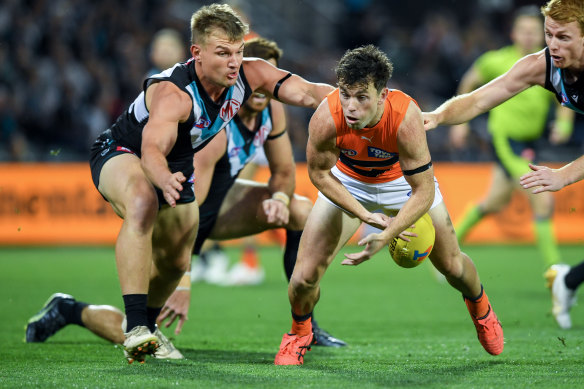 Brent Daniels of the Giants competes with Ollie Wines of Port Adelaide.