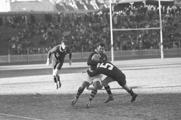 An Australian player is tackled by a New Zealand lock on June 28, 1947.