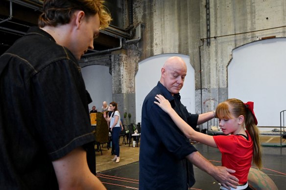 Anthony Warlow playing Oliver “Daddy” Warbucks (centre) and Dakota Chanel with choreographer Mitchell Woodcock in a rehearsal for Annie.