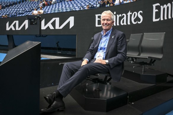 Craig Tiley tests out one of the new courtside pods on Rod Laver Arena.