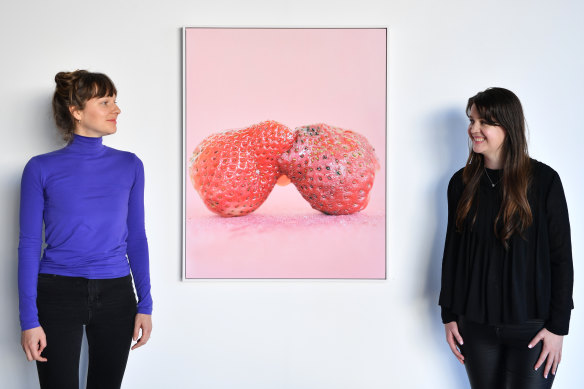 Artist Svetlana Bailey  with Artereal Gallery’s Rhianna Walcott and artwork ‘Passion Berry’.