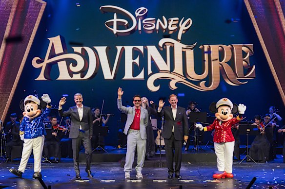 Actor Robert Downey Jr (centre) christens Disney Adventure in the ship’s theatre, alongside incoming Disney CEO Josh D’Amaro (left) and Disney Signature Experiences president Joe Schott.