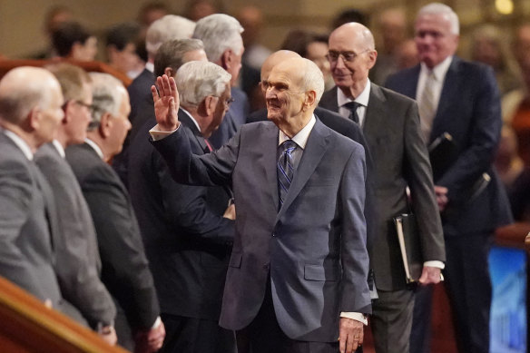 The Church of Jesus Christ of Latter-day Saints President Russell M. Nelson (centre) waves as he arrives during the twice-annual church conference in Salt Lake City in April 2022.