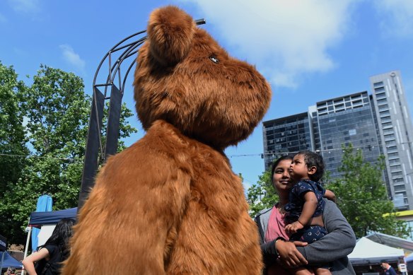 Bhuvana Sundaram and her 11 month old son Skandan look at the installation Dancing Teddy 2.0 by artist EJ Son as part of the Parramatta Lanes festival.