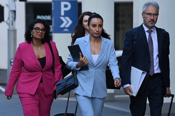 Antoinette Lattouf (centre) at a Fair Work Commission hearing against the ABC in March.