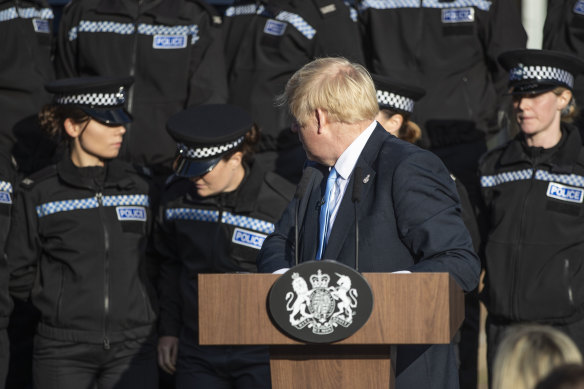 A student officer behind Prime Minister Boris Johnson nearly fainted during his press conference.