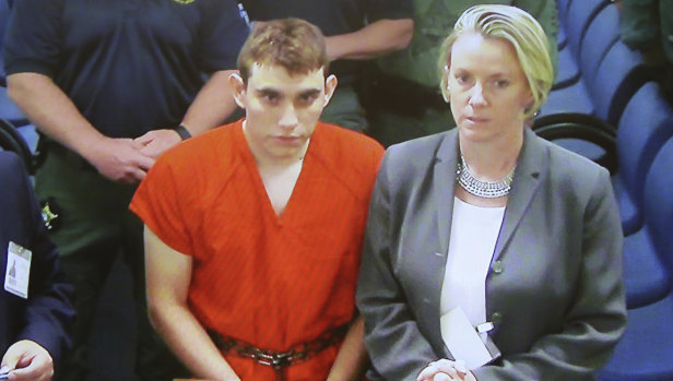 A video monitor shows school shooting suspect Nikolas Cruz, in a brief court appearance on Thursday.