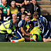 Mo Toure receives medical attention.
