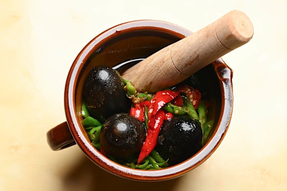Smashed peppers with century egg salad.