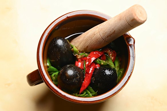 Smashed peppers with century egg salad.