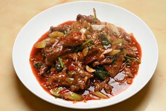 Stir-fried Zigong-style chilli beef with fresh chilli and pickled ginger.