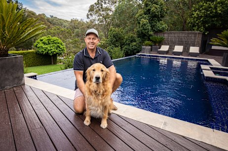 Dave Tucker, and dog Murphy, enjoying the pool at their home in North Warrandyte which has hit the market.