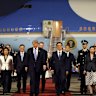 US President Donald Trump is greeted by Chinese youth, a military honour guard and military band as he arrives at Beijing Capital International Airport on Wednesday.
