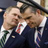White House national security adviser Mike Waltz, left, speaks with US Secretary of Defence Pete Hegseth last month. Waltz added the journalist to the group chat, Hegseth divulged highly sensitive military details.