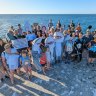 A “community photoshoot” held Thursday night to promote responsible fishing at Ammunition Jetty, Coogee. 