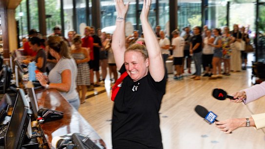 Amanda Blok from Penrith reacts as she buys tickets to Taylor Swift. She arrived early this morning and was first in line to buy Tickets for her 9 year old daughter Callie. She previously got scammed $600 on tickets. (phone 0430011526). Taylor swift fans gathered to buy tickets for her Sydney and Melbourne shows at the Ticketek outlet at Penrith Panthers. 