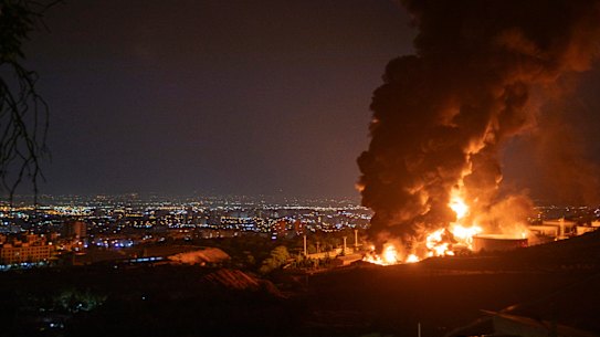 TEHRAN, IRAN - JUNE 15: Fire and smoke rise into the sky after an Israeli attack on the Shahran oil depot on June 15, 2025 in Tehran, Iran. Iran’s foreign minister said the country would respond decisively and proportionally to a wave of attacks that Israel launched beginning in the early hours of June 13. The attacks targeted multiple military, scientific and residential locations, as well as senior government officials. (Photo by Stringer/Getty Images) *** BESTPIX ***