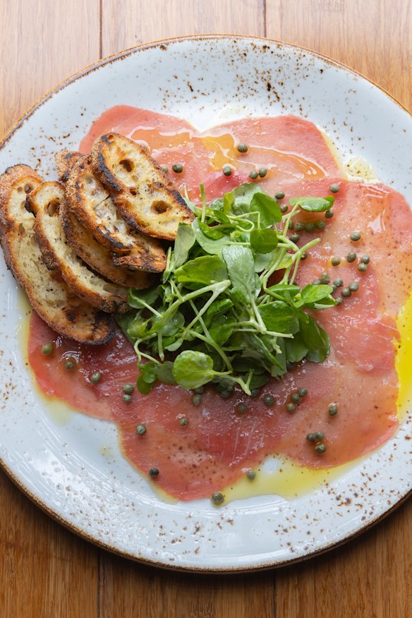 Tuna carpaccio, watercress, lime, baby capers, sourdough. 