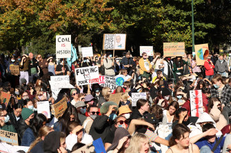 Protesters gather in Melbourne’s Treasury Gardens for a climate rally on Friday.