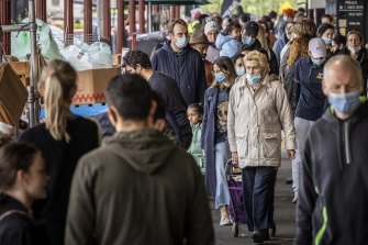 Shoppers with masks at South Melbourne Market yesterday as Melbourne’s COVID-19 restrictions continued. 