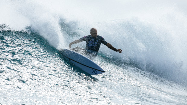 Champion surfer Kelly Slater competes at Margaret River on Friday. Competitors were taken from the break on jet skis on Sunday after a shark was spotted just before 4pm local time. 
