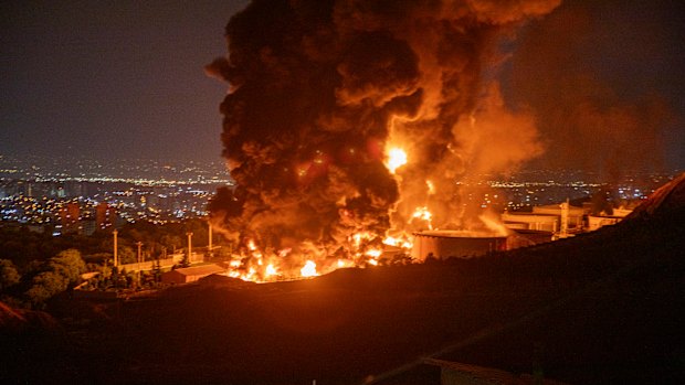 Fire and smoke rise into the sky after an Israeli attack on the Shahran oil depot in Tehran on June 15, two days after Israel first struck the city and other targets across Iran.