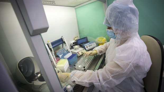 A medical staffer works with test systems for the diagnosis of coronavirus in Krasnodar, Russia.