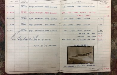 Log book with entry by rear gunner Ray Wilkinson.