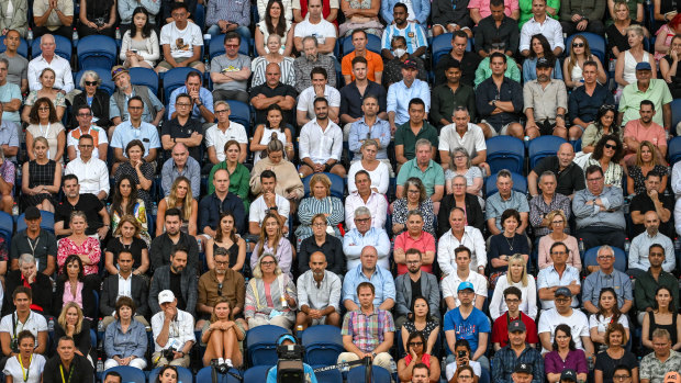 The Australian Open has drawn record crowds. Spectators watch the men’s singles quarter-finals between  Novak Djokovic and Andrey Rublev at Rod Laver Arena.