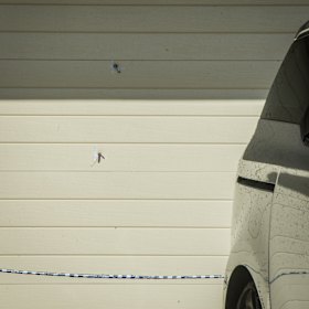 Bullet holes in the garage door of a home in Kambah.