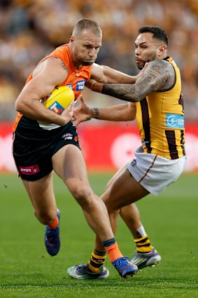 Impey grapples GWS forward Jake Stringer.