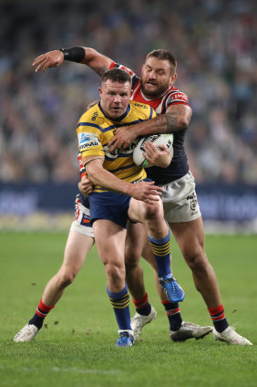 Nathan Brown is tackled by Jared Waerea-Hargraves.