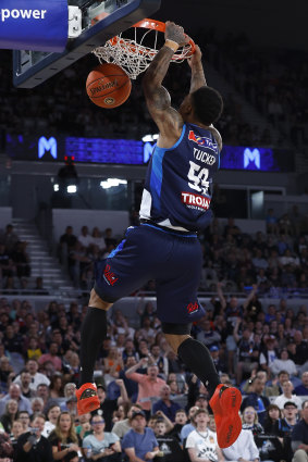 United’s Rayjon Tucker dunks against the Breakers.