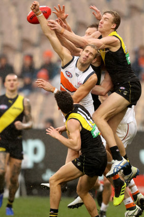 Up and about: Richmond forward Tom Lynch leaps for a mark against the Giants.