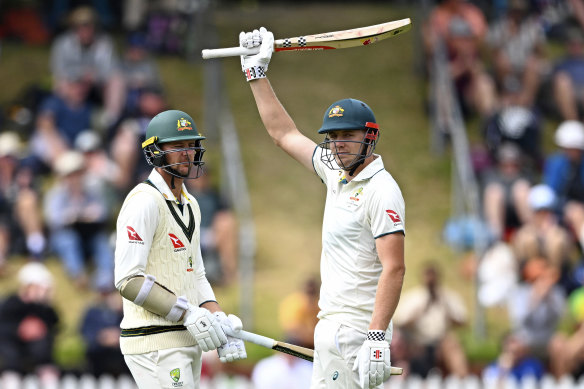 Cam Green raises the bat after reaching 150 against New Zealand.