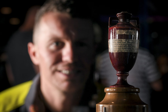 Peter Siddle lays his eyes on the real Ashes urn for the first time ever at the SLV on Tuesday. 