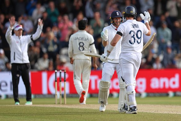 England’s Joe Root (second right) and batting partner Jamie Smith celebrate after their win on day five of the first Test against India at Headingley.