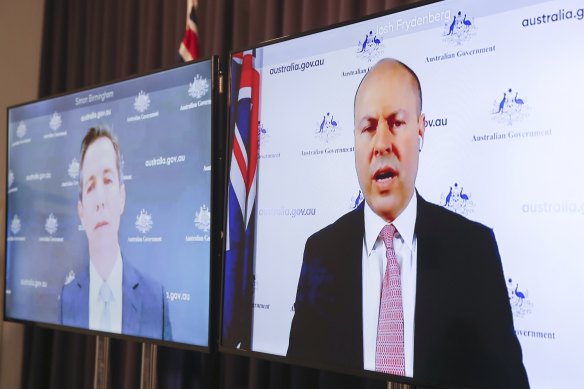 Minister for Finance Simon Birmingham and Treasurer Josh Frydenberg deliver the 2020-21 final budget outcome on Thursday. 