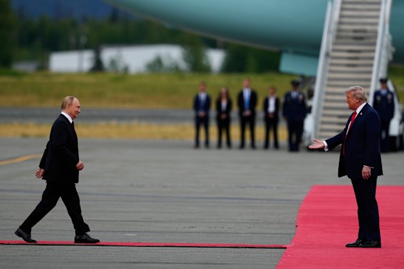 Vladimir Putin strides down the red carpet towards a waiting Donald Trump in Alaska at the weekend.