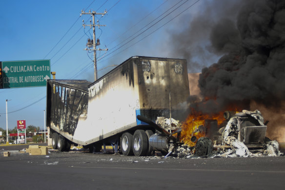 A truck burns on a street in Culiacan, Sinaloa state, after the arrest of Ovidio Guzman, son of jailed drug lord El Chapo.